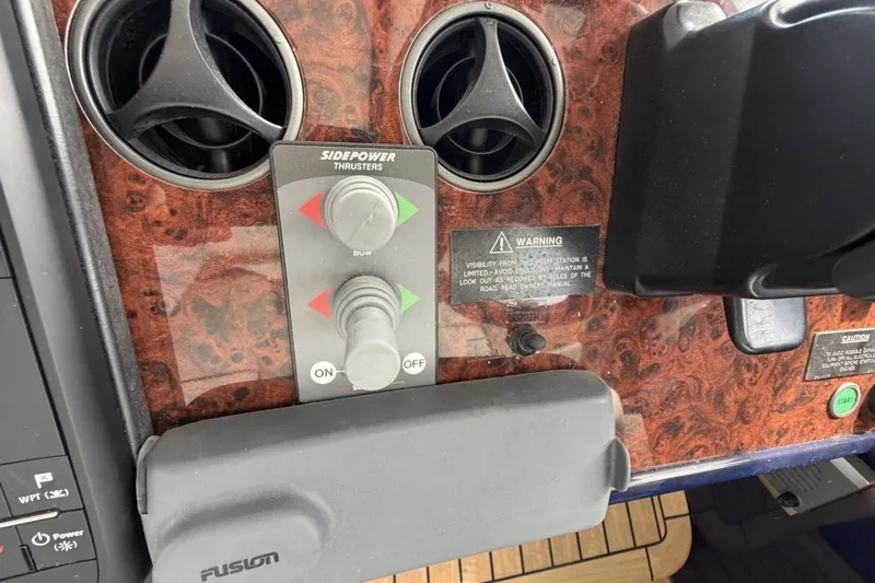Slide: The Image of Control panel of a 2001 Viking Sport Cruisers V65 with Sidepower thrusters. - 59