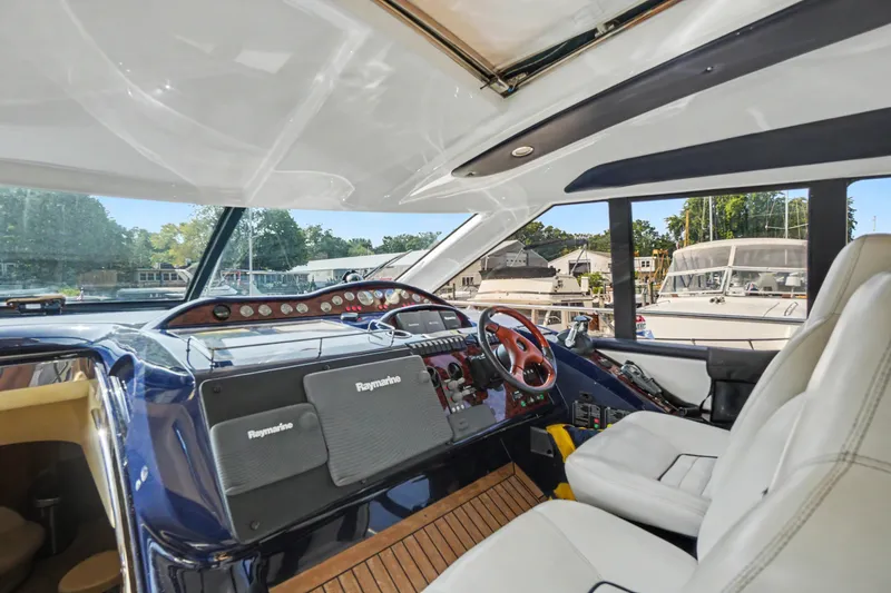 Slide: The Image of Interior view of 2001 Viking Sport Cruisers V65 yacht cockpit with modern navigation equipment. - 45