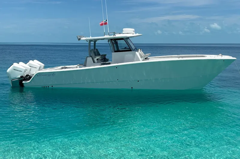 The Image of 2025 Freeman 35 boat on clear turquoise water, featuring twin Mercury engines. - 0