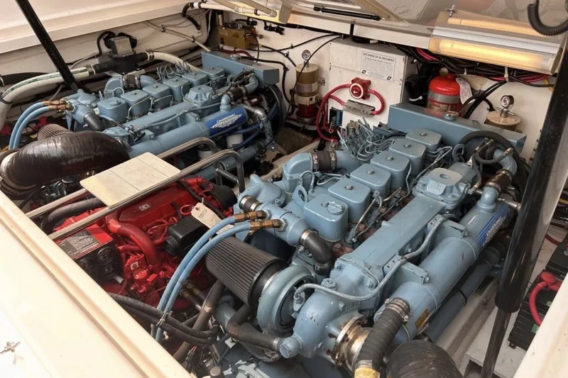 Slide: The Image of Engine room of a 1999 Tiara Yachts 3500 Open, featuring dual marine engines. - 14
