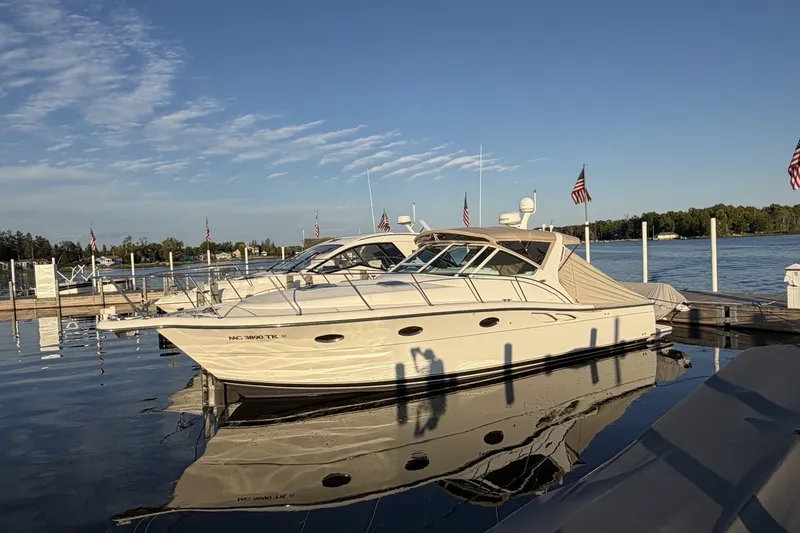 The Image of 1999 Tiara Yachts 3500 Open docked at a marina under clear skies. - 0