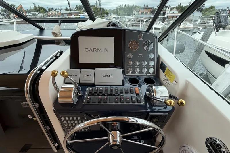 Slide: The Image of Control panel of a 1999 Tiara Yachts 3500 Open with Garmin navigation system. - 17