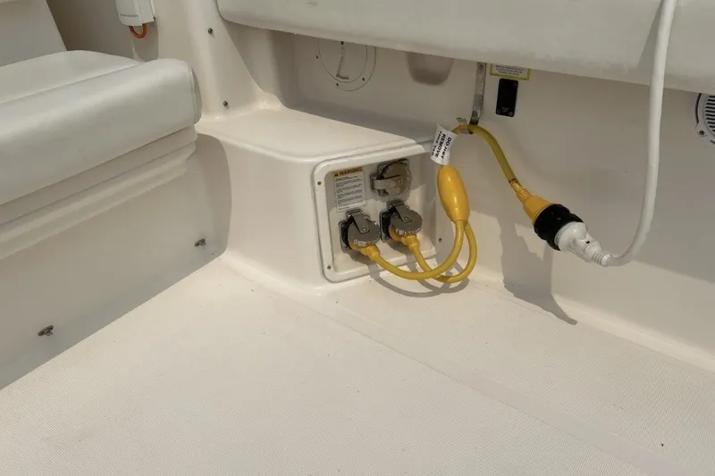 Slide: The Image of 1999 Tiara Yachts 3500 Open electrical connections with yellow power cables on deck. - 14