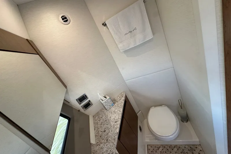 Slide: The Image of Luxurious bathroom in 2017 Sea Ray Sundancer 460 yacht with modern fixtures and elegant design. - 31