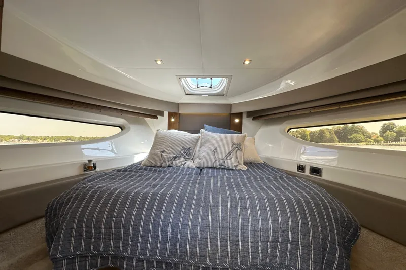 Slide: The Image of Luxurious cabin interior of 2017 Sea Ray Sundancer 460 yacht with cozy bedding. - 33