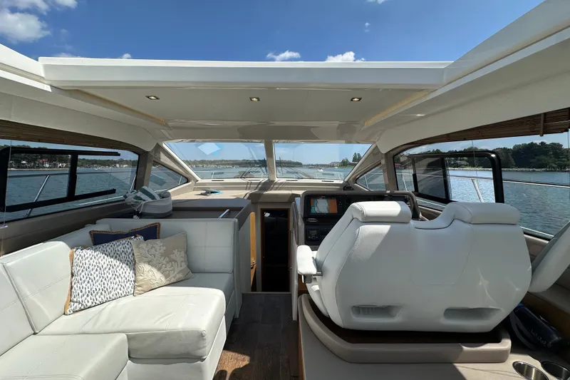Slide: The Image of Interior of 2017 Sea Ray Sundancer 460 yacht with luxurious seating and helm. - 18