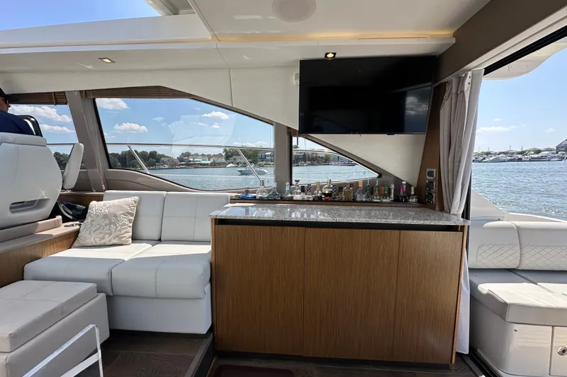 Slide: The Image of Luxurious interior of 2017 Sea Ray Sundancer 460 yacht with bar and waterfront view. - 12