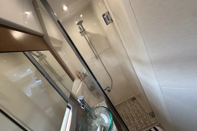 Slide: The Image of Luxurious bathroom in 2017 Sea Ray Sundancer 460 yacht with modern shower and glass sink. - 37