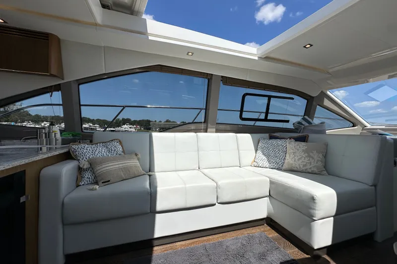 Slide: The Image of Luxurious interior of 2017 Sea Ray Sundancer 460 yacht with white leather seating. - 14