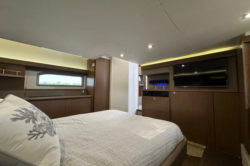 Slide: The Image of Luxurious interior of 2017 Sea Ray Sundancer 460 yacht with modern bedroom amenities. - 29