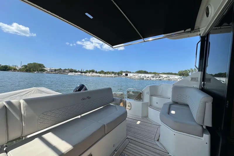 Slide: The Image of 2017 Sea Ray Sundancer 460 yacht interior with waterfront view and luxurious seating. - 8