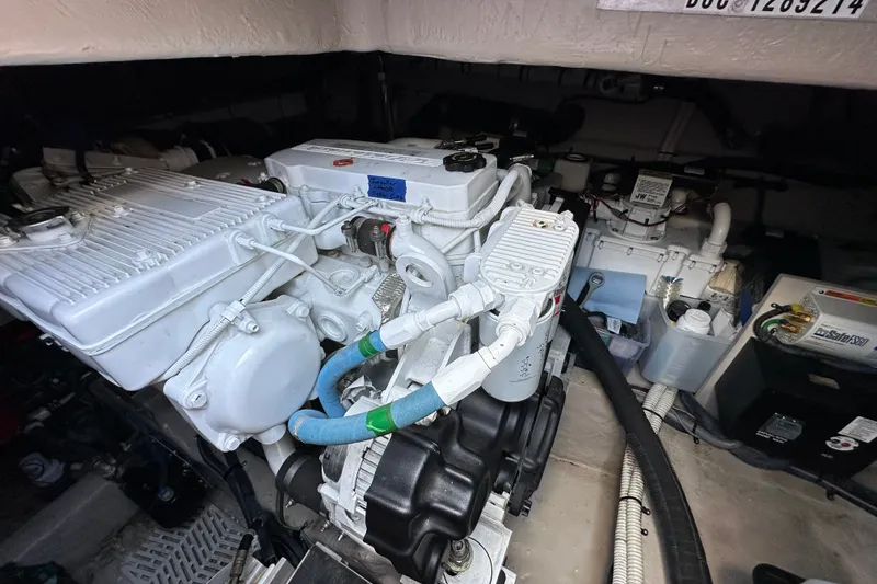 Slide: The Image of Engine compartment of 2017 Sea Ray Sundancer 460, showcasing mechanical components and systems. - 41