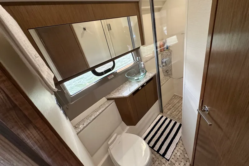 Slide: The Image of Luxurious bathroom in 2017 Sea Ray Sundancer 460 yacht with modern fixtures. - 36