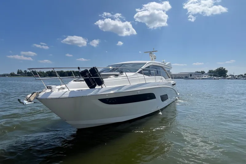 Slide: The Image of 2017 Sea Ray Sundancer 460 yacht cruising on a sunny day with clear skies. - 42