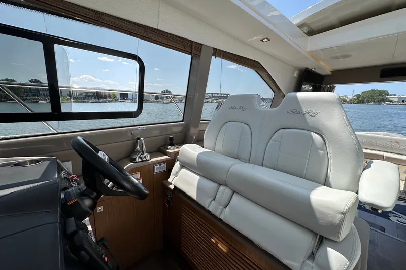 Slide: The Image of Interior of 2017 Sea Ray Sundancer 460 yacht with helm and plush seating. - 20