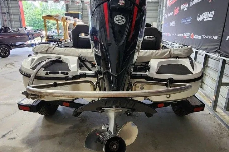 Slide: The Image of 2021 Nitro Z18 boat with powerful outboard motor in a showroom setting. - 5
