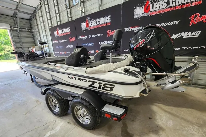 Slide: The Image of 2021 Nitro Z18 boat with Mercury engine in showroom setting. - 7