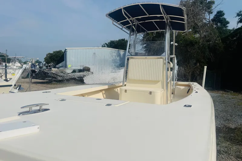 Slide: The Image of 2015 Jones Brothers Bateau 23 boat with T-top, parked outdoors. - 3