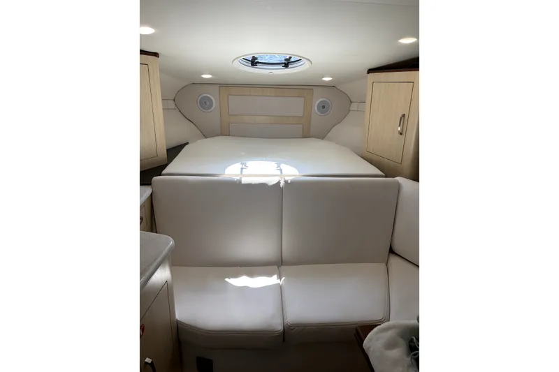 Slide: The Image of Interior of 2025 Regal 33 Express yacht with cozy seating and modern design. - 16