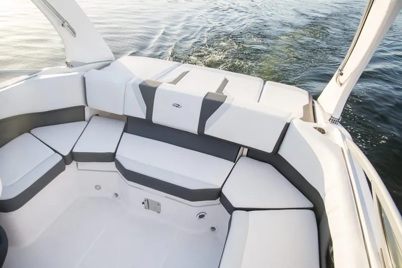 Slide: The Image of Manufacturer Provided Image: 2026 Regal 2000 ES boat interior with white and gray seating, on calm water. - 5