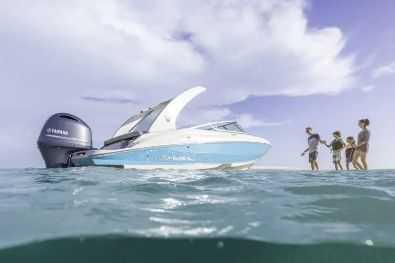 Slide: The Image of Manufacturer Provided Image: 2026 Regal 21 OBX boat on water with family enjoying a sunny day. - 2