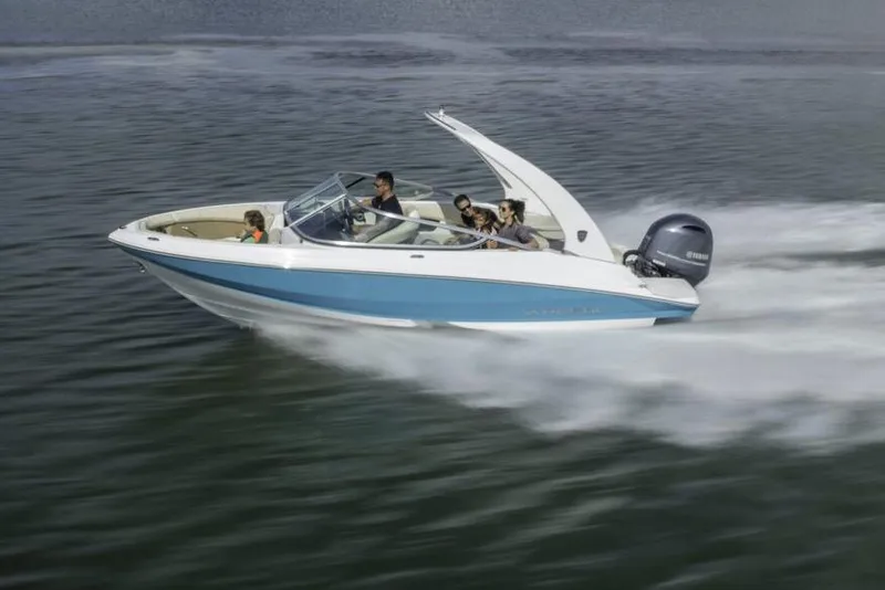 Slide: The Image of Manufacturer Provided Image: 2026 Regal 21 OBX speedboat cruising on water with passengers enjoying the ride. - 1