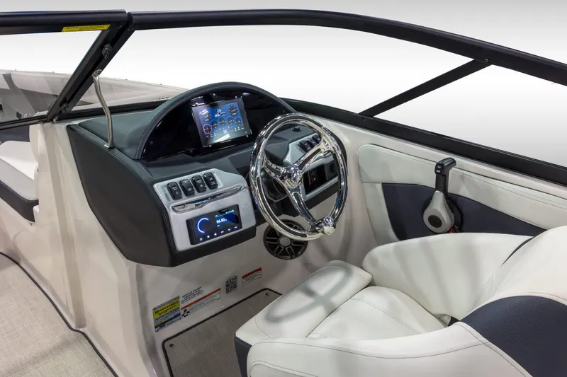 Slide: The Image of Manufacturer Provided Image: 2026 Regal 21 OBX boat cockpit with modern steering and control panel. - 4