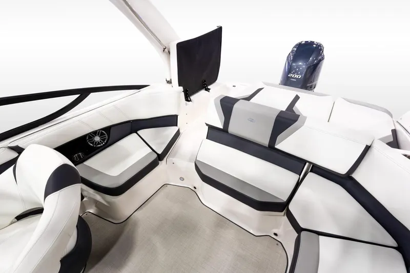 Slide: The Image of Manufacturer Provided Image: 2026 Regal 21 OBX boat interior with white and black seating, showcasing modern design. - 6