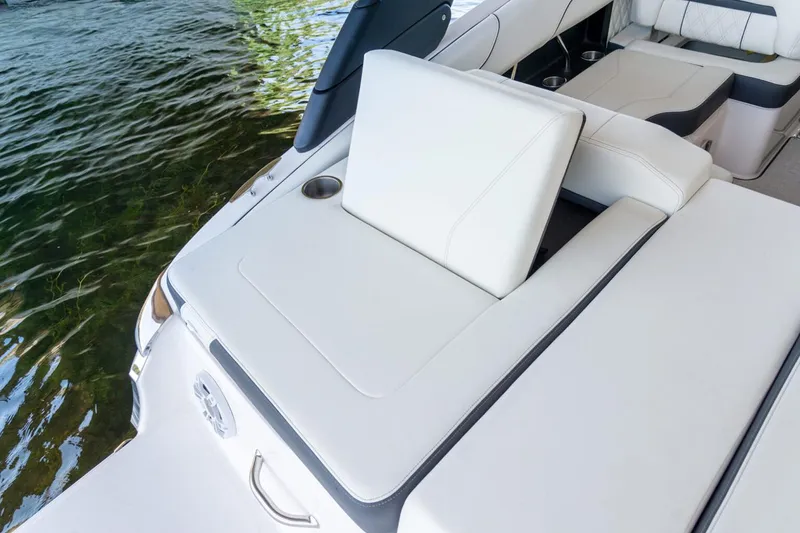 Slide: The Image of Manufacturer Provided Image: 2026 Regal LS2 boat with luxurious white seating by the water. - 9