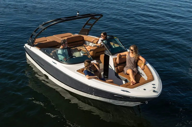 Slide: The Image of Manufacturer Provided Image: 2026 Regal LS2 boat cruising with passengers on a sunny day. - 1