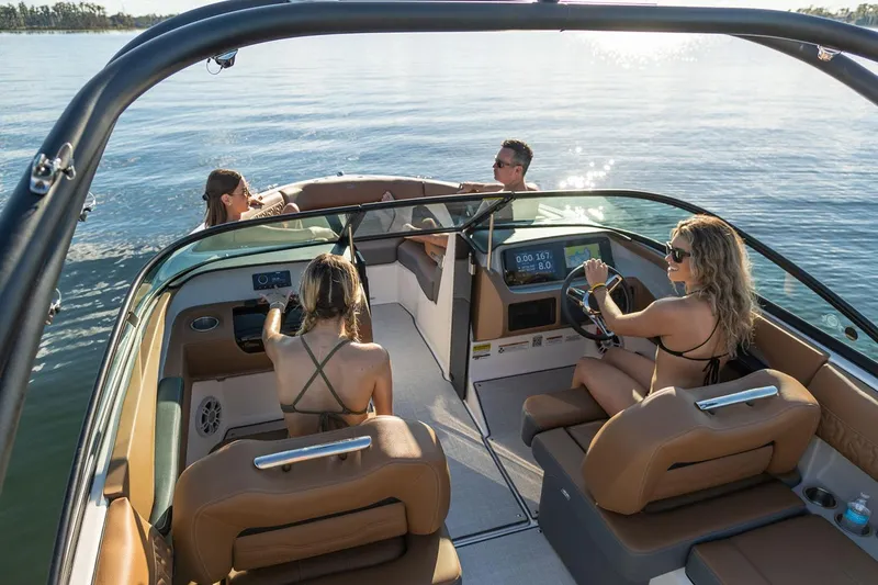 Slide: The Image of Manufacturer Provided Image: 2026 Regal LS2 Surf boat with passengers enjoying a sunny day on the water. - 9