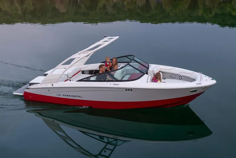Slide: The Image of Manufacturer Provided Image: 2026 Regal LS2 Surf boat cruising on calm water with passengers onboard. - 3