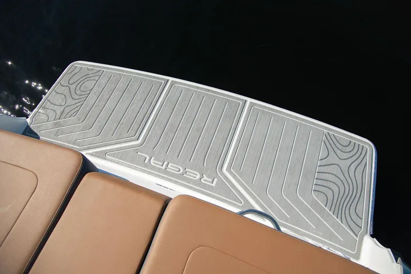 Slide: The Image of Manufacturer Provided Image: 2026 Regal LS2 Surf boat swim platform with textured design and brown seating. - 10