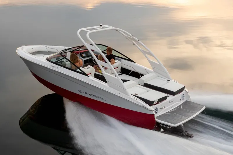The Image of Manufacturer Provided Image: 2026 Regal LS2 Surf boat cruising on calm water at sunset. - 0
