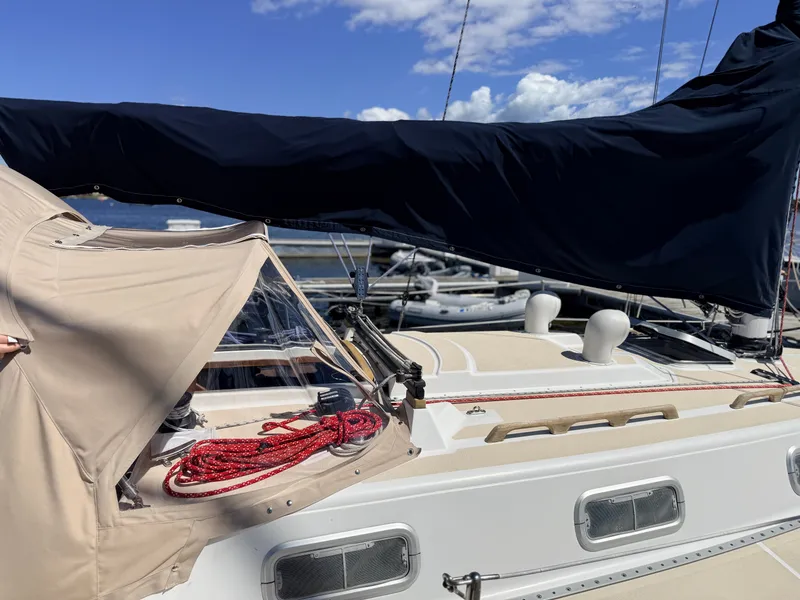 Slide: The Image of A 1992 Tartan T 31 sailboat with covers and red ropes on the deck. - 5