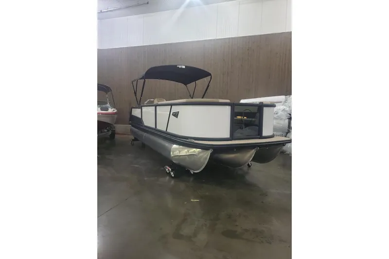The Image of 2027 Alera A22L pontoon boat in indoor showroom, featuring sleek design and canopy. - 0