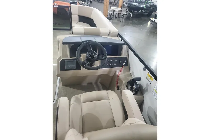 Slide: The Image of Interior view of 2027 Alera A22L boat cockpit with steering wheel and controls. - 17