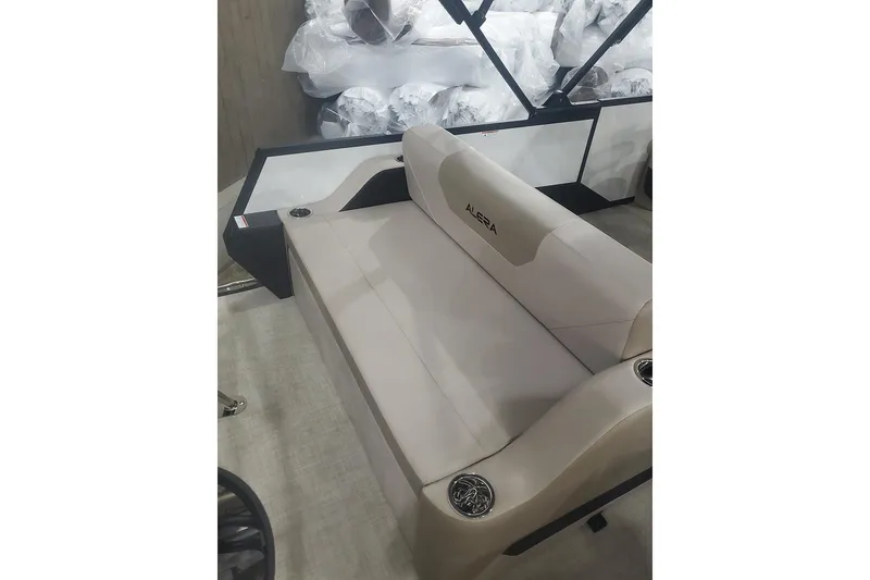 Slide: The Image of 2027 Alera A22L boat seat with beige upholstery and cup holders. - 15