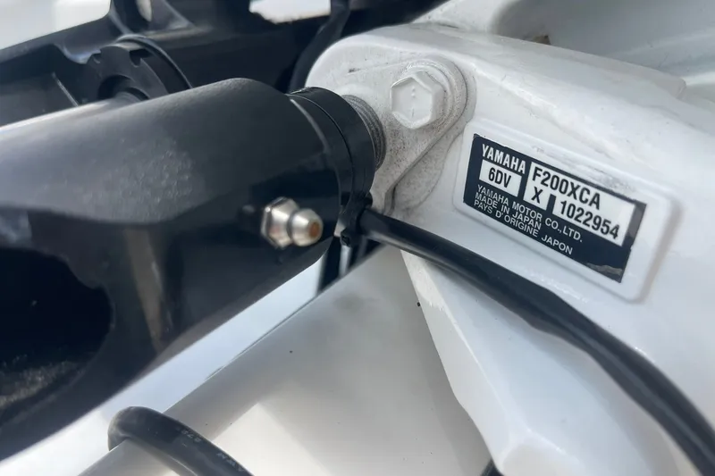Slide: The Image of Close-up of Yamaha F200XCA engine label on 2023 Edgewater 262CC boat. - 20