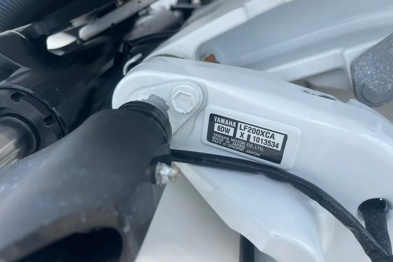 Slide: The Image of Close-up of Yamaha LF200XCA engine part on 2023 Edgewater 262CC boat. - 19