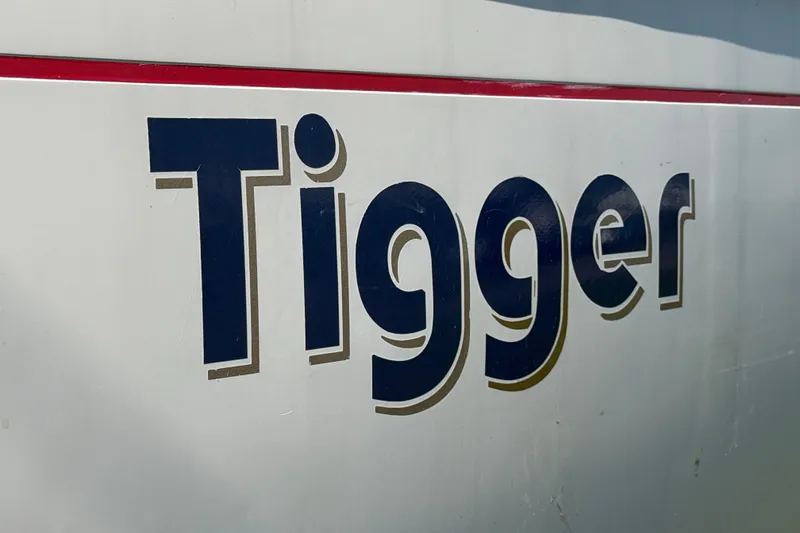 Slide: The Image of Close-up of 'Tigger' name on 1984 C&C 33 MK II sailboat hull. - 30
