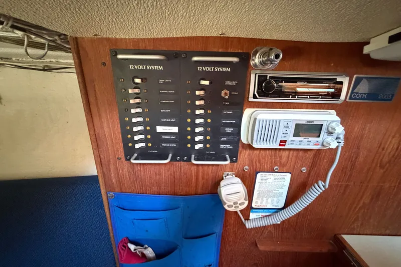 Slide: The Image of Electrical panel and radio system inside a 1984 C&C 33 MK II sailboat cabin. - 37