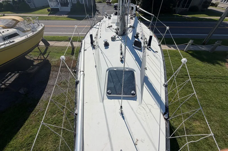 Slide: The Image of 1984 C&C 33 MK II sailboat deck view, showcasing rigging and hatch. - 24
