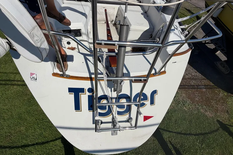 Slide: The Image of 1984 C&C 33 MK II sailboat stern with "Tigger" name and US Sailing sticker. - 29