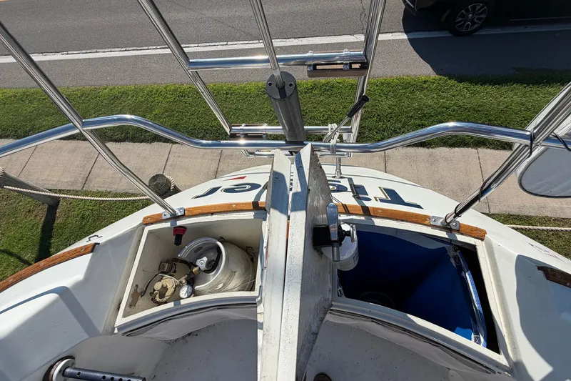 Slide: The Image of 1984 C&C 33 MK II sailboat stern view with open storage compartments. - 8