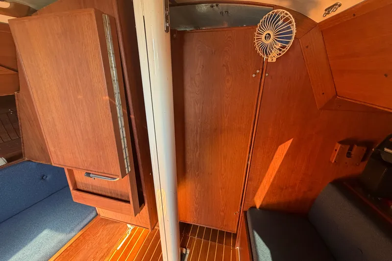 Slide: The Image of Interior of 1984 C&C 33 MK II sailboat with wooden cabinetry and seating. - 54