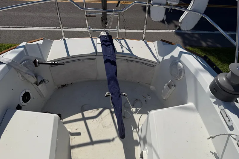 Slide: The Image of Cockpit of a 1984 C&C 33 MK II sailboat with covered tiller and equipment. - 27