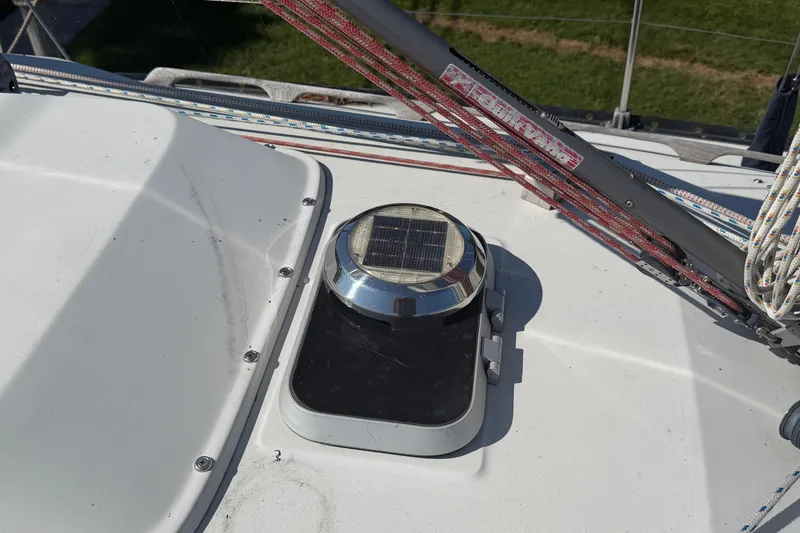 Slide: The Image of Solar vent on 1984 C&C 33 MK II sailboat deck with rigging ropes. - 19
