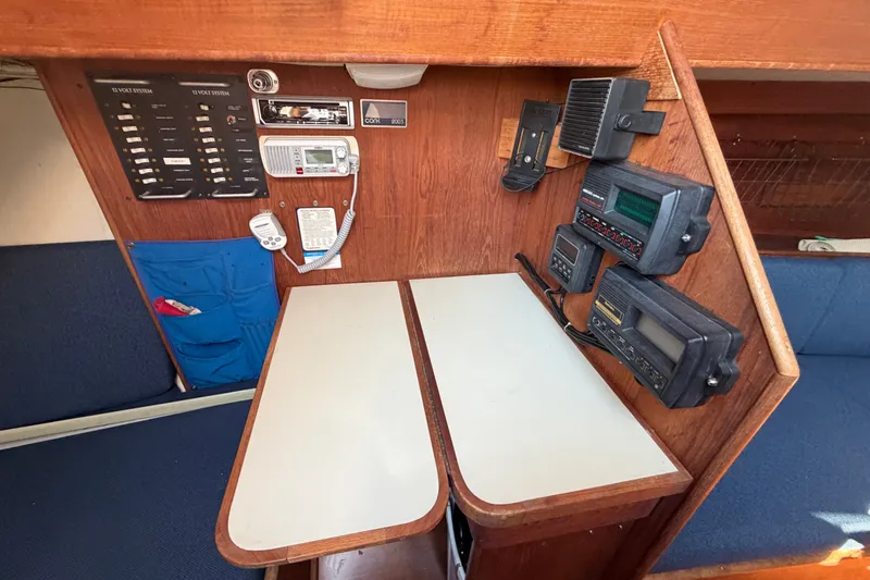 Slide: The Image of Navigation station of a 1984 C&C 33 MK II sailboat with communication equipment. - 40