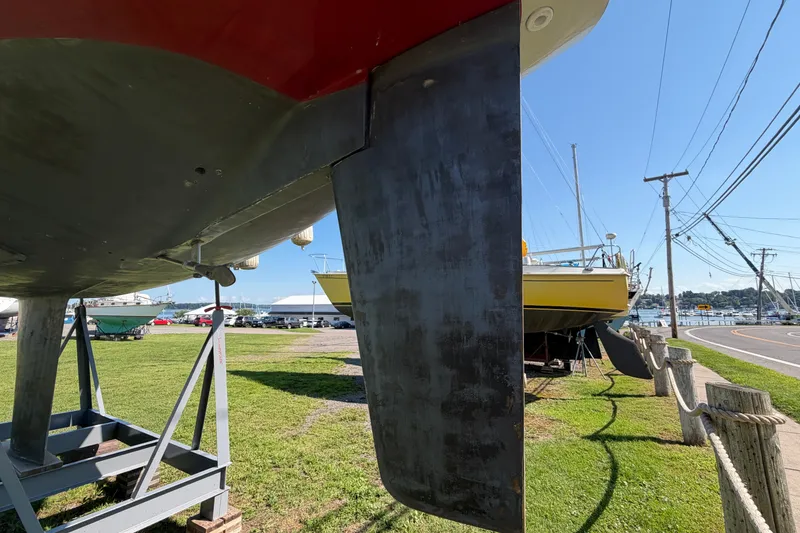 Slide: The Image of 1984 C&C 33 MK II sailboat on stands, marina background, sunny day. - 3
